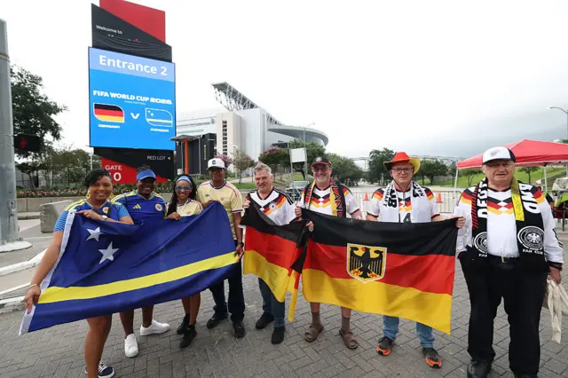 Curacao and Germany fans posing for pictures outside the Houston Stadium