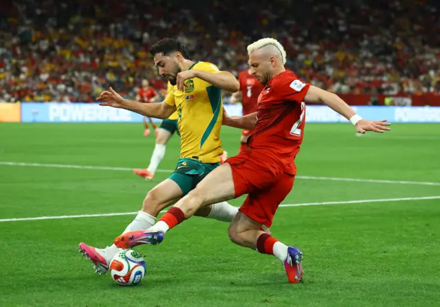 Turkey's Baris Alper Yilmaz in action with Australia's Jacob Italiano