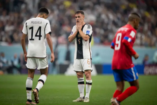 Joshua Kimmich with his hands on his head for Germany