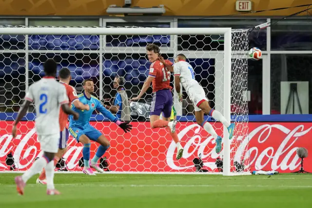 Scotland's Jack Hendry heads the ball clear under pressure from Haiti's Wilson Isidor (right) during the FIFA World Cup Group C match at Boston Stadium, Foxborough.