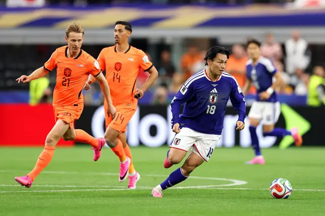 Ayase Ueda controls the ball