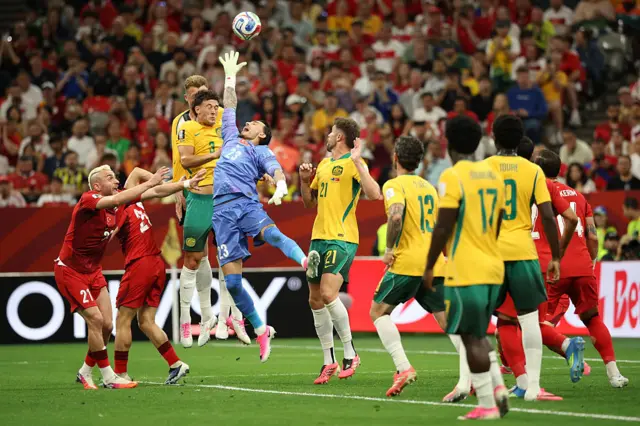 Ugurcan Cakir #23 of Turkiye competes for the ball against Alessandro Circati #3 and Harry Souttar #19 of Australia during the FIFA World Cup 2026 Group D match between Australia and Türkiye at BC Place Vancouver