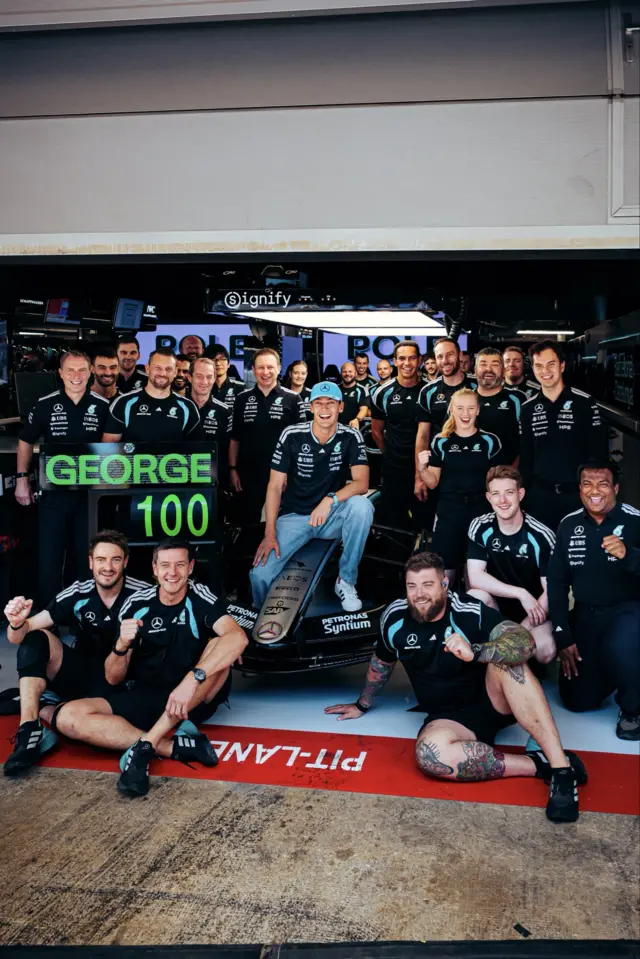 The Mercedes team celebrate George Russell's 100th GP