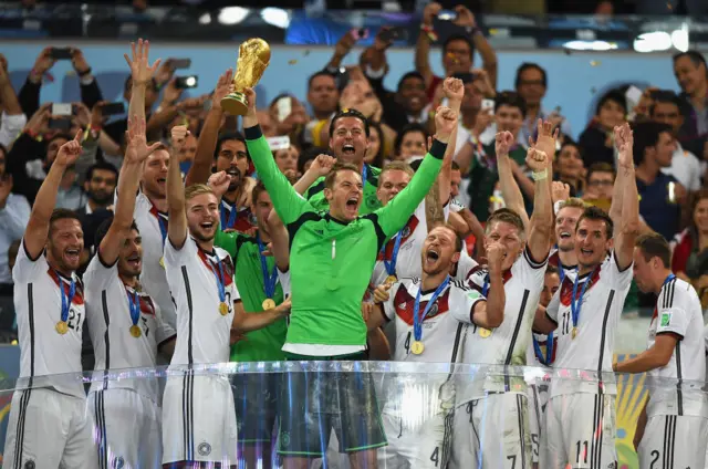 Germany goalkeeper Manuel Neuer lifting the World Cup