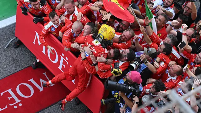 Lewis Hamilton celebrating with his team