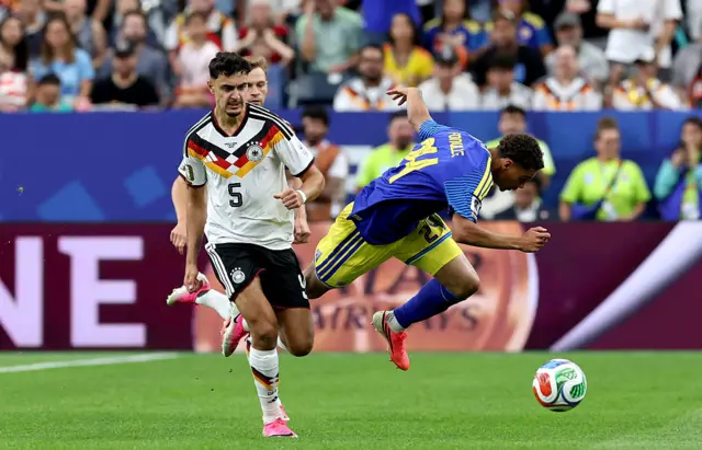 Aleksandar Pavlovic #5 of Germany is challenged by Deveron Fonville #24 of Curacao