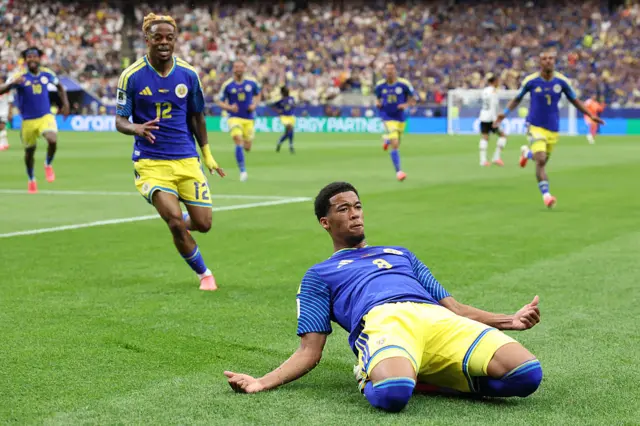 Livano Comenencia #8 of Curacao celebrates scoring