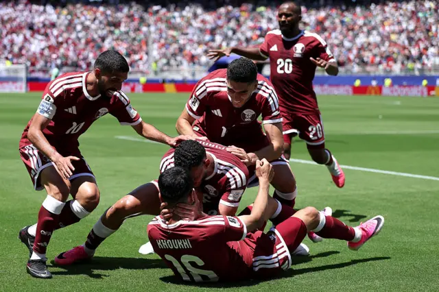 Qatar players celebrate