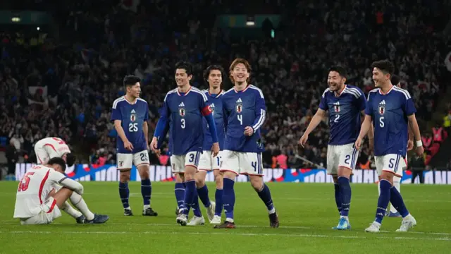 Japan celebrate beating England in March