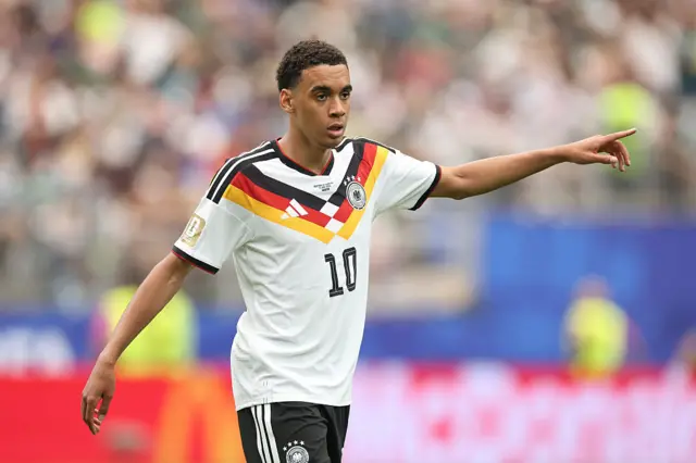 Jamal Musiala #10 of Germany gestures