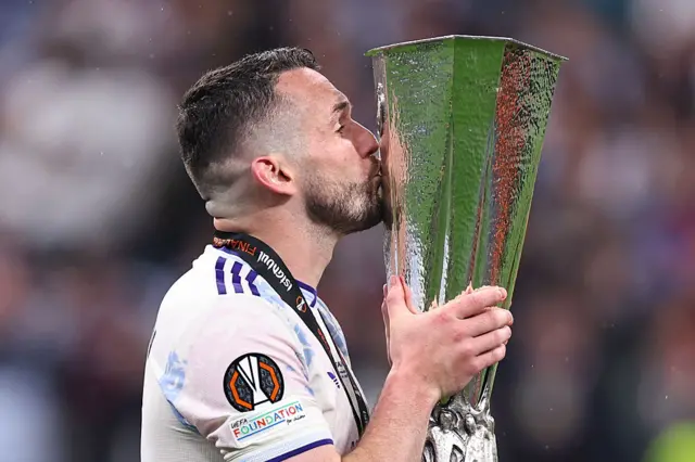 John McGinn kisses the Europa League trophy