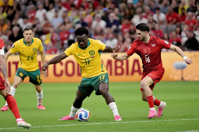 Nestory Irankunda of Australia, Ismail Yuksek of Turkey during the World Cup match between Australia v Turkey at the Vancouver Stadium on June 13, 2026 in Vancouver Canada