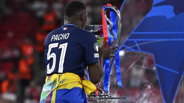 Willian Pacho holds the Champions League trophy