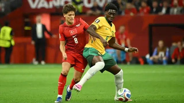 Australia's Mohamed Toure in action with Turkey's Arda Guler