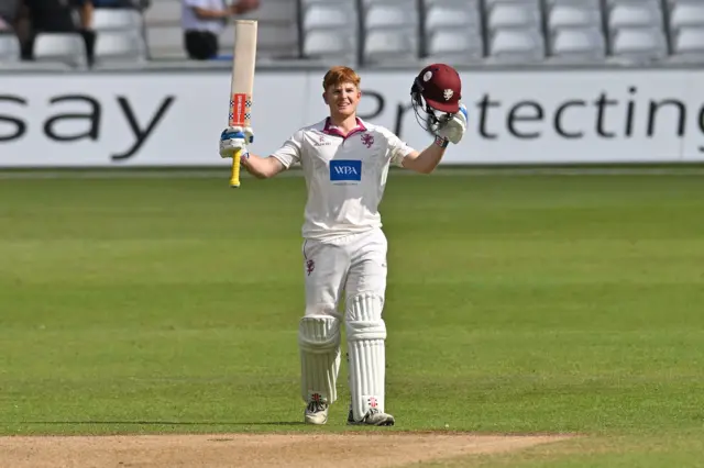 Thomas Rew raises his bat for 100