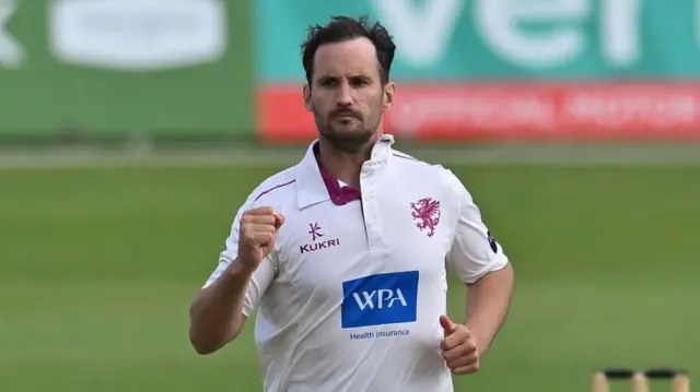 Lewis Gregory celebrates
