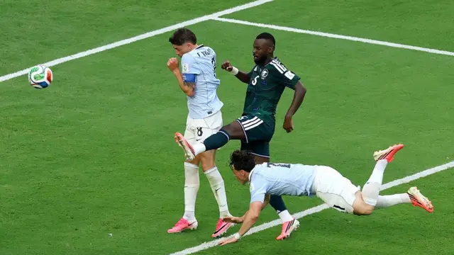 Federico Vinas of Uruguay dives to head the ball