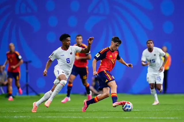 Pedri Gonzalez of Spain and Kevin Pina of Cabo Verde compete for the ball
