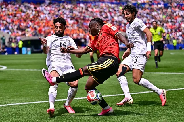 Jeremy Doku fights for the ball