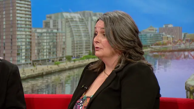 Louise Gibson in a black blazer with a colourful top in the BBC Breakfast studio