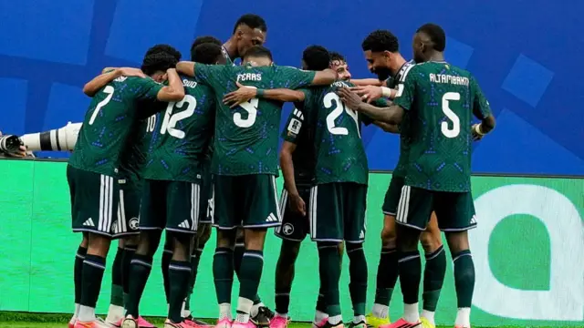 Saudi Arabia players in a huddle