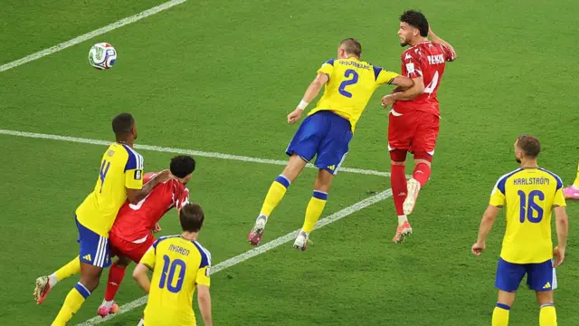 Omar Rekik of Tunisia heads to score the team's first goal