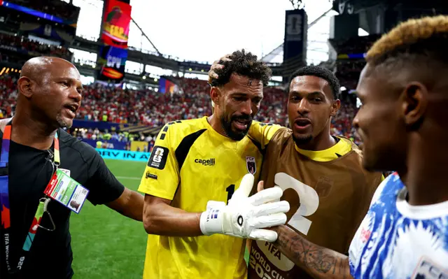 Vozinha #1 of Cabo Verde embraces teammates after the 0-0 draw