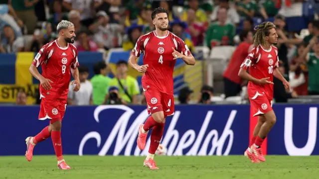 Omar Rekik of Tunisia celebrates the team's first goal