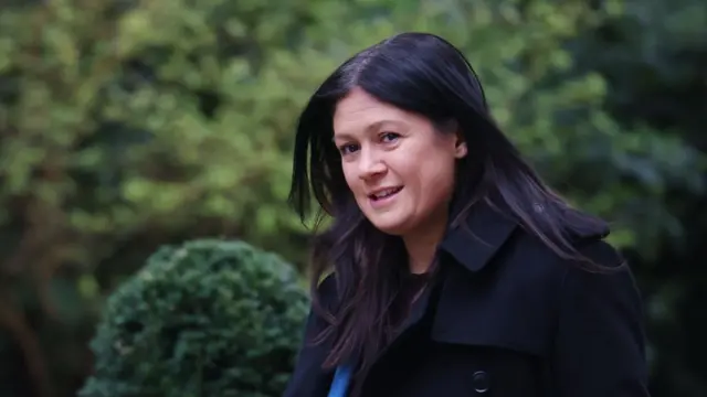 Culture Secretary Lisa Nandy pictured outside Downing Street wearing black macintosh jacket earlier this year