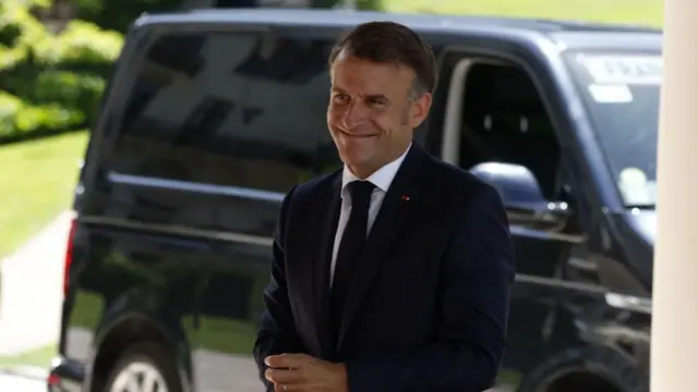 Macron arrives at the Hotel Royal ahead of the G7 summit in Évian-les-Bains, France.