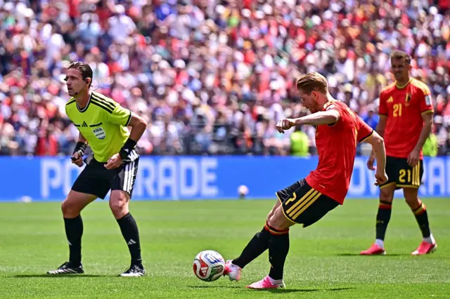 Kevin De Bruyne takes a free-kick