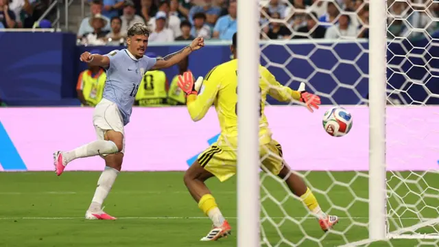 Maxi Araujo of Uruguay scores