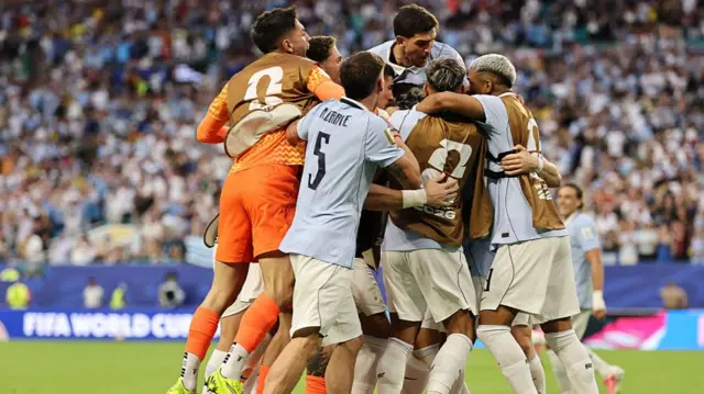Uruguay players celebrate scoring