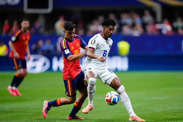 Kevin Pina of Cabo Verde and Pedri Gonzalez of Spain compete for the bal