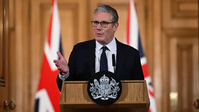 A photo of Keir Starmer at a news conference in Downing Street