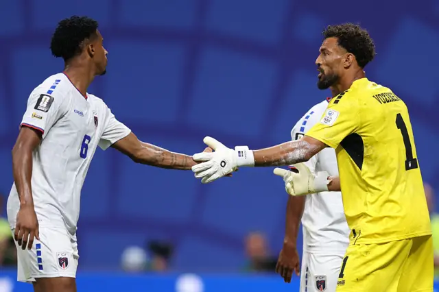 Vozinha #1 of Cabo Verde reacts with Kevin Pina #6 after a save