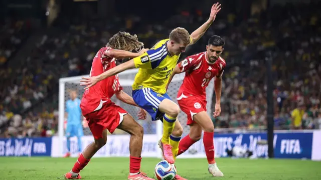 Alexander Bernhardsson f Sweden controls the ball against Hannibal Mejbri