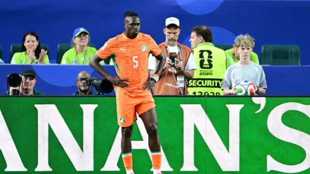 Wilfried Singo of Ivory Coast looks on
