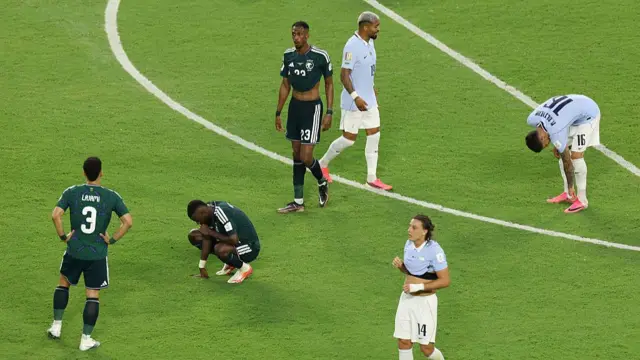 Players from both sides react at full-time