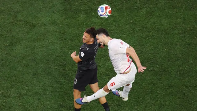 : Ryan Thomas and Saeid Ezatolahi Iran compete for the ball