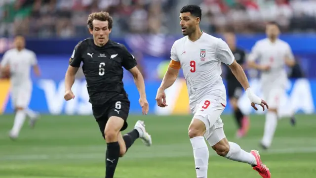 Mehdi Taremi of Iran controls the ball