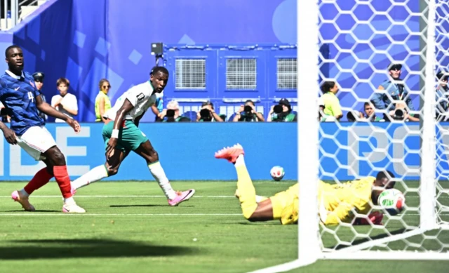 Senegal's Nicolas Jackson hits the post with a shot as the rebound comes off France's Mike Maignan