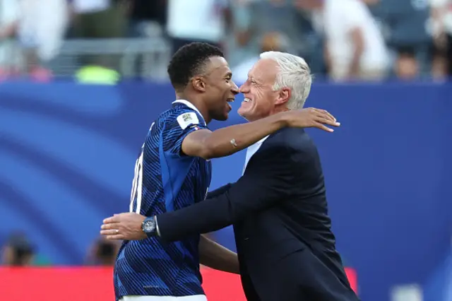 France's head coach Didier Deschamps congratulates his forward Kylian Mbappe