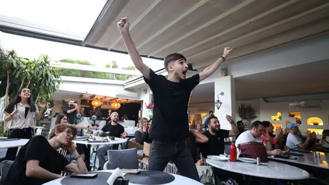 ranians react to the 2026 World Cup football tournament match between Iran and New Zealand at a cafe in Tehran, Iran, on June 16, 2026. (