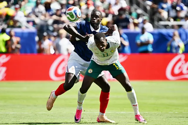 Dayot Upamecano and Senegal's forward Nicolas Jackson fight for the ball