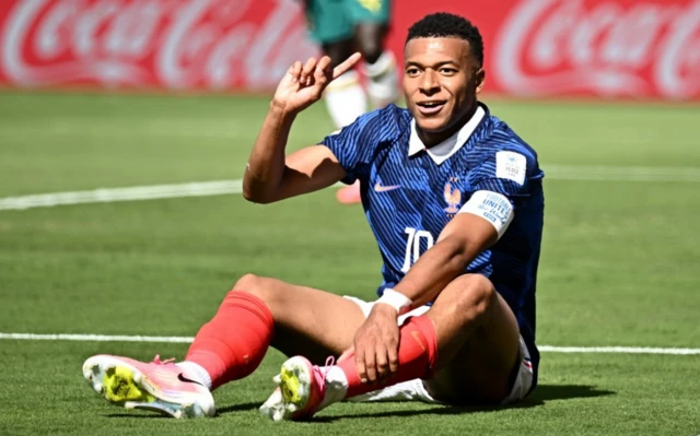 France's Kylian Mbappe reacts after a challenge