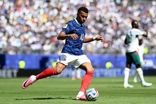 Kylian Mbappe #10 of France controls the ball