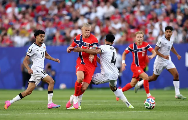 Erling Haaland of Norway is challenged by Zaid Tahseen
