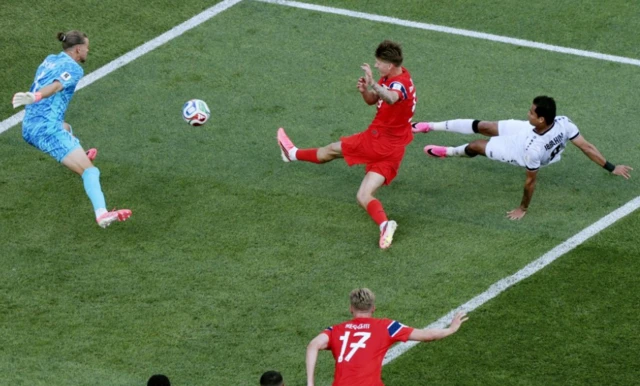 Norway's David Moller Wolfe blocks the shot