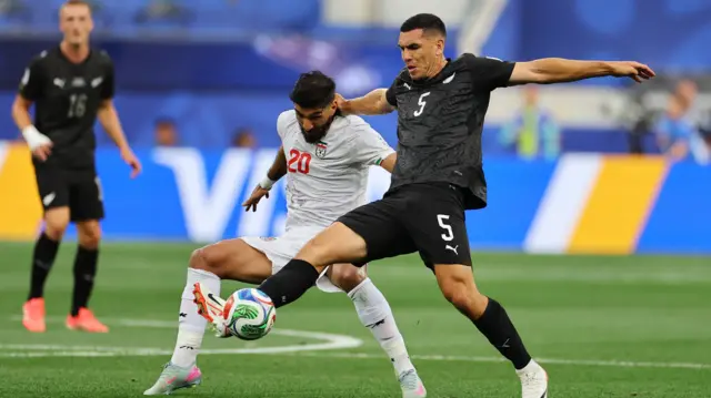New Zealand's Michael Boxall in action with Iran's Shahriyar Moghanlou
